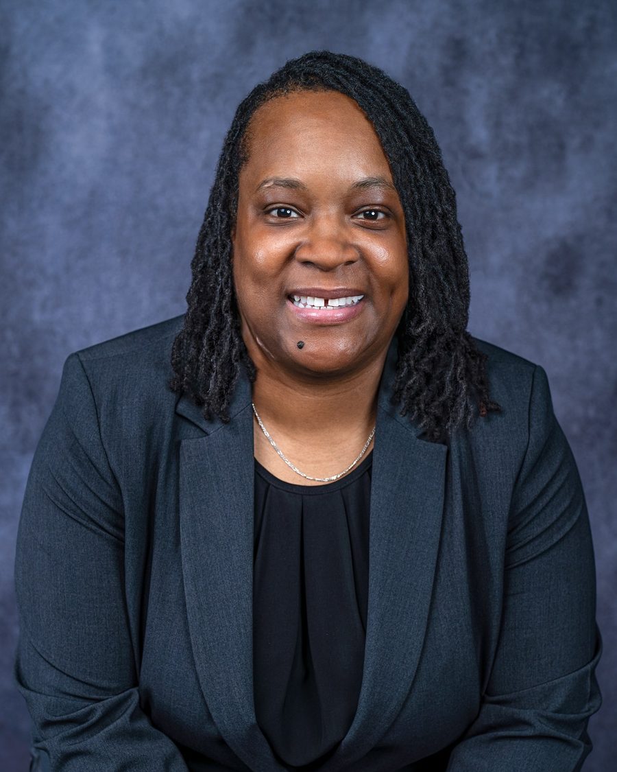 Danitza Mack, founder and CEO of D. Mack Consulting Group, in a charcoal blazer